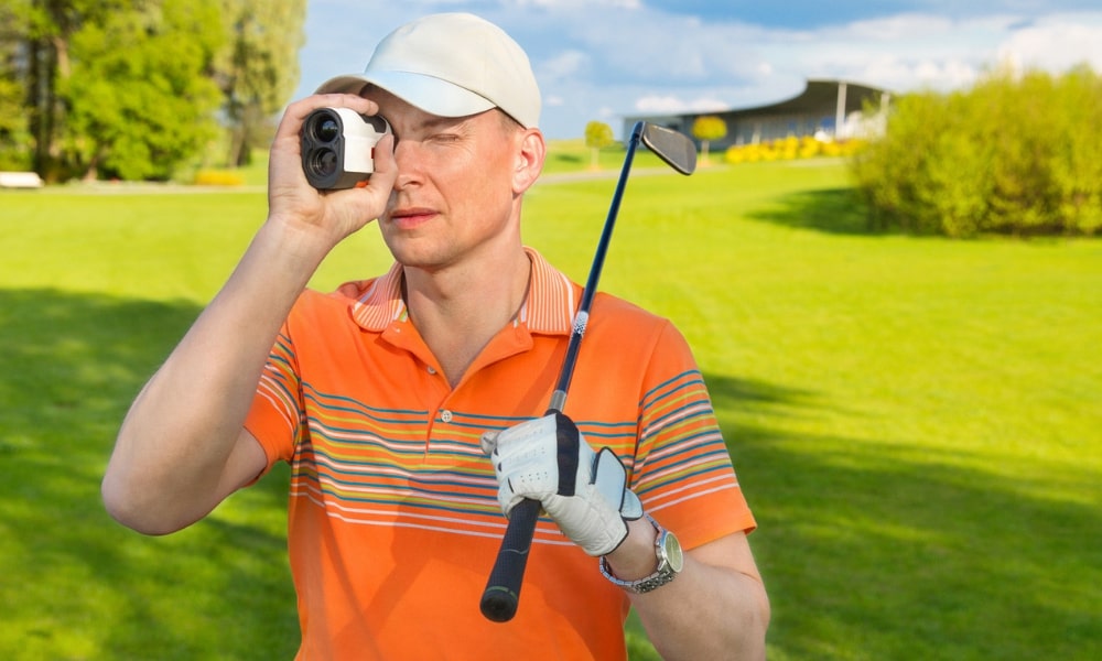 Golfer using rangefinder