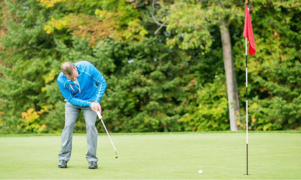 Golfer taking a putt