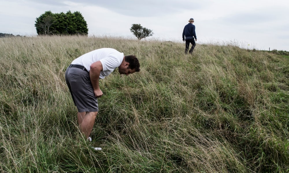 Golfer looking for his ball