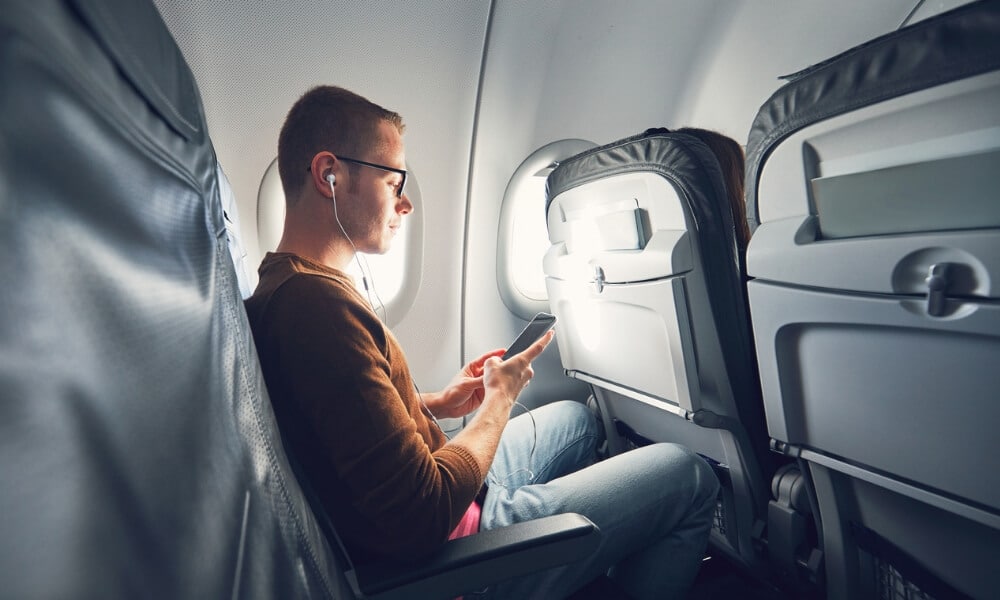 On the phone on a plane
