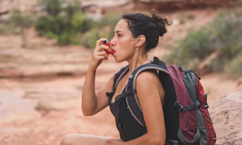 Trekker using an inhaler