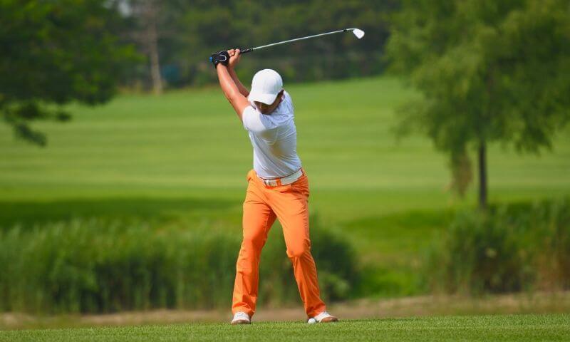 Golfer adhering to the dress code
