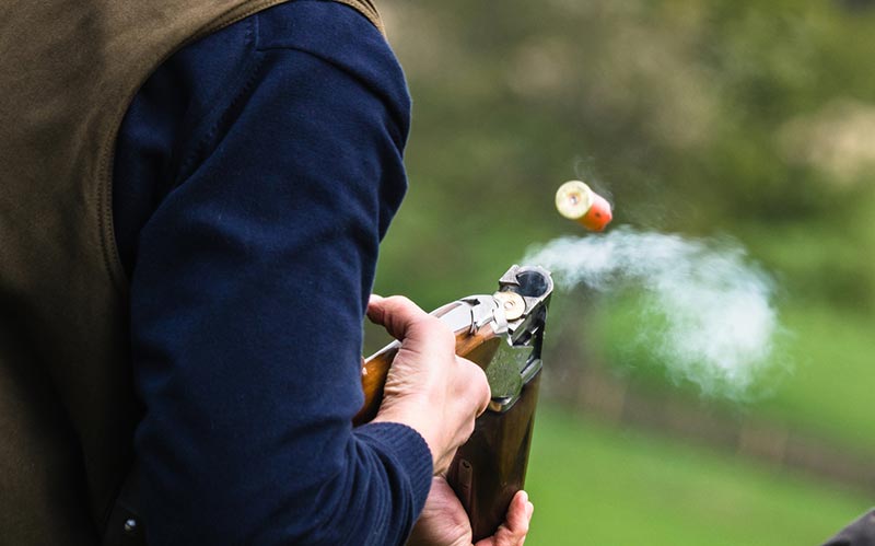 Shotgun ejecting a shell