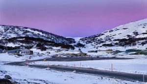 Colourful sunrise over Perisher valley regional remote town in Snowy Mountains of Australia