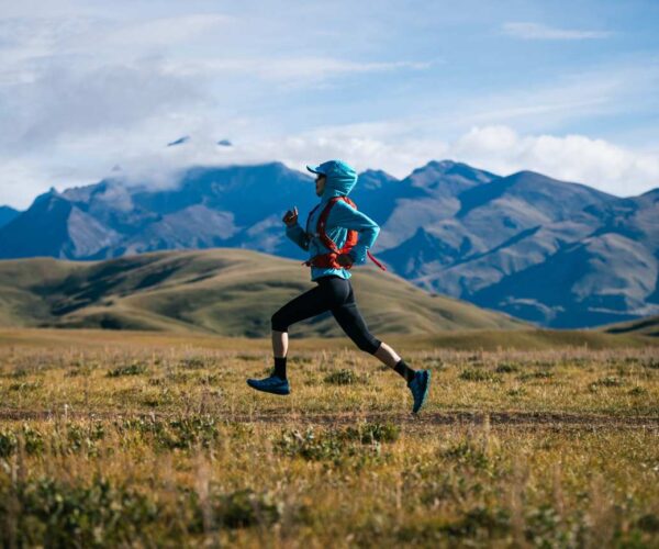 Woman endurance running in mountains