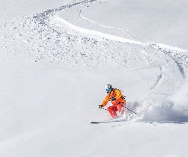Skier making fresh tracks on slope