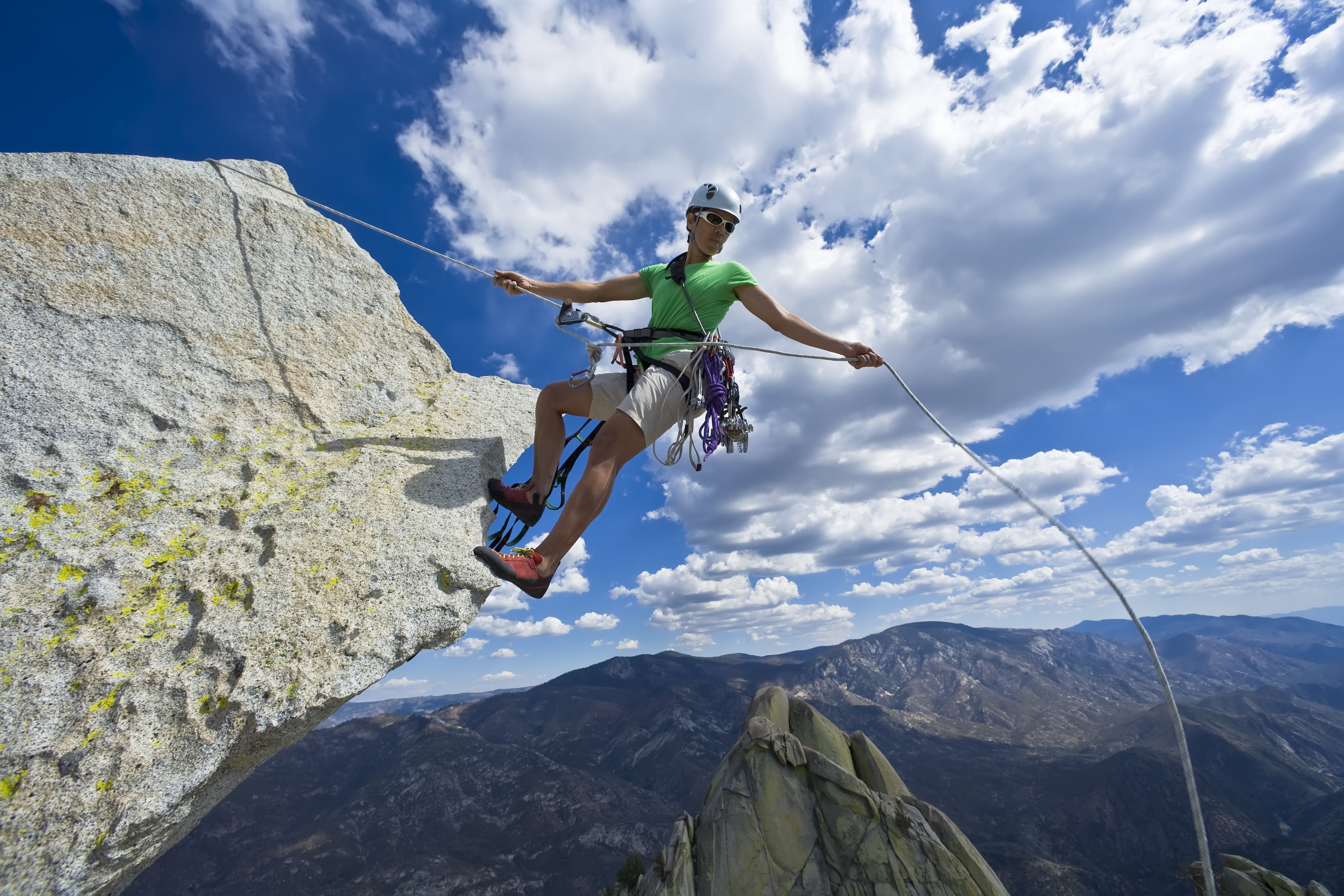 Climber abseiling from summit