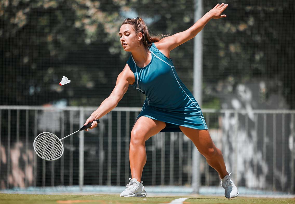 Female player hitting shuttlecock