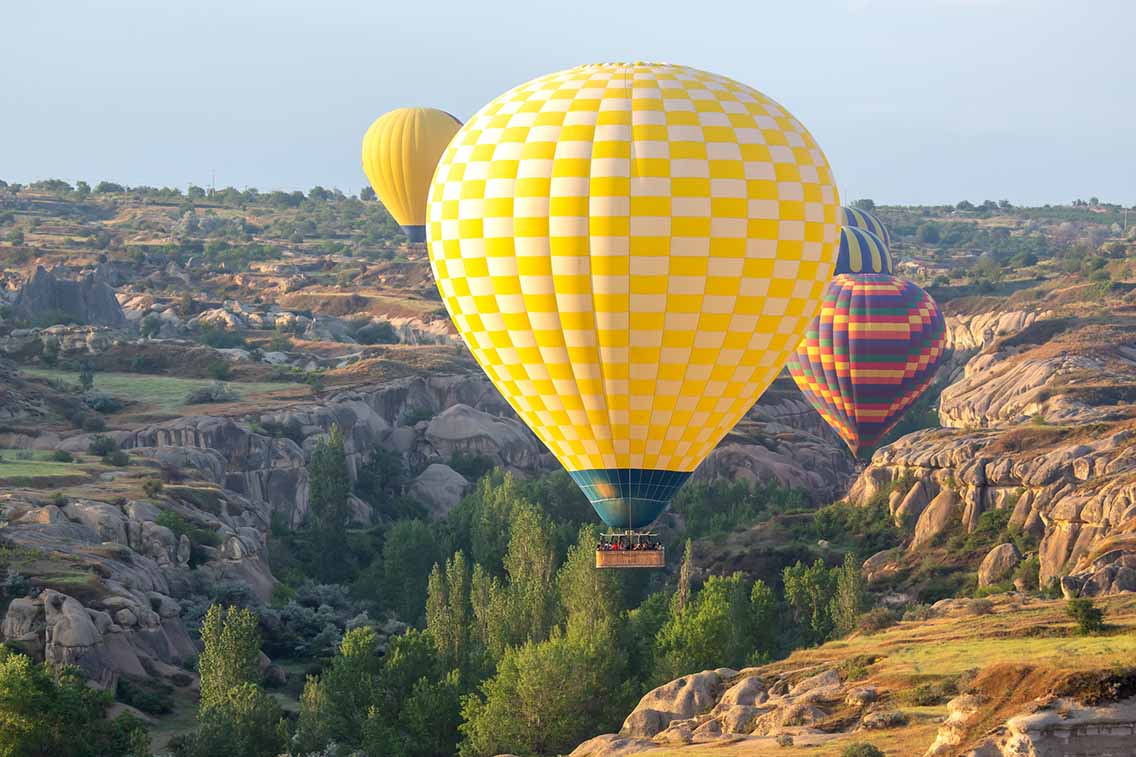 Hot air balloons with passengers in famous Turkey spot