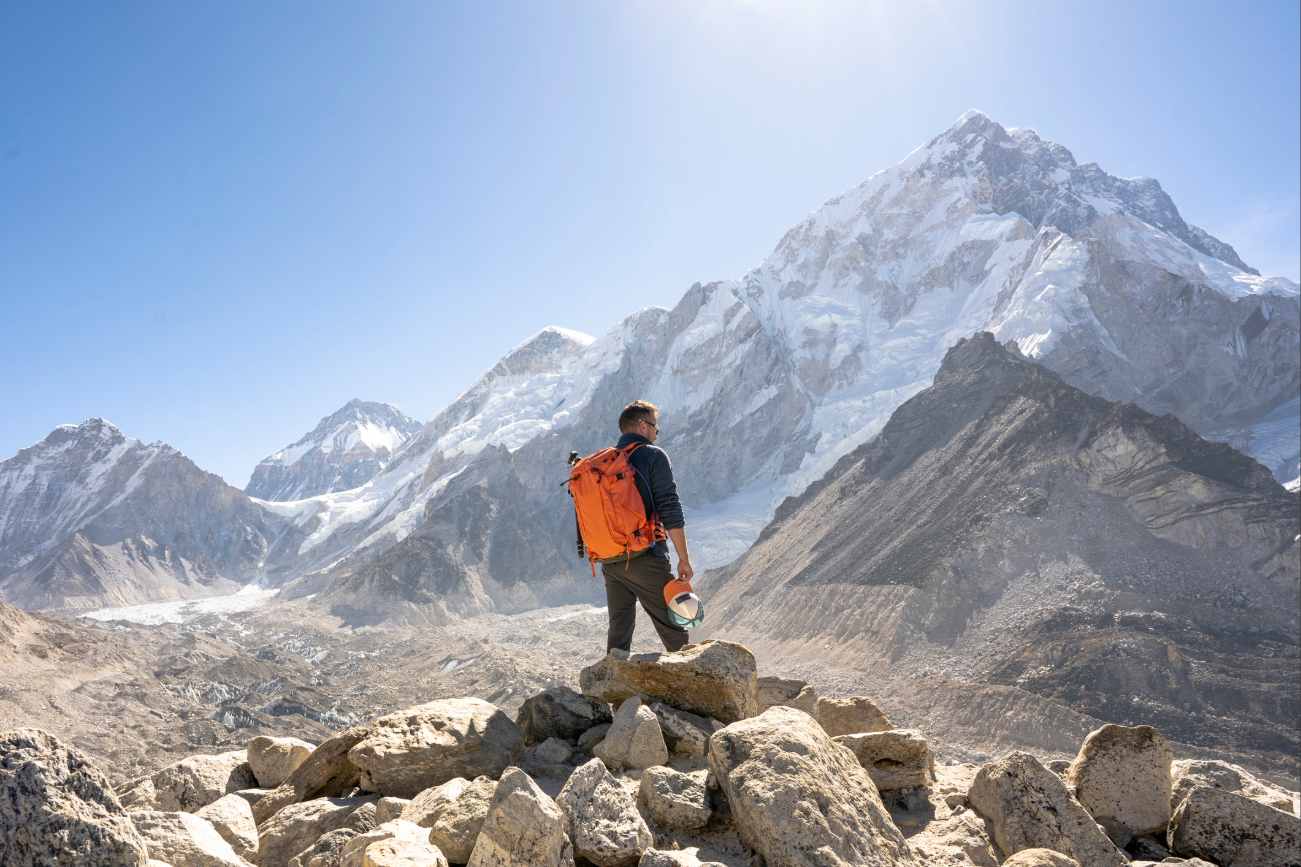 Man hiking in Himalayas with view of everest base camp