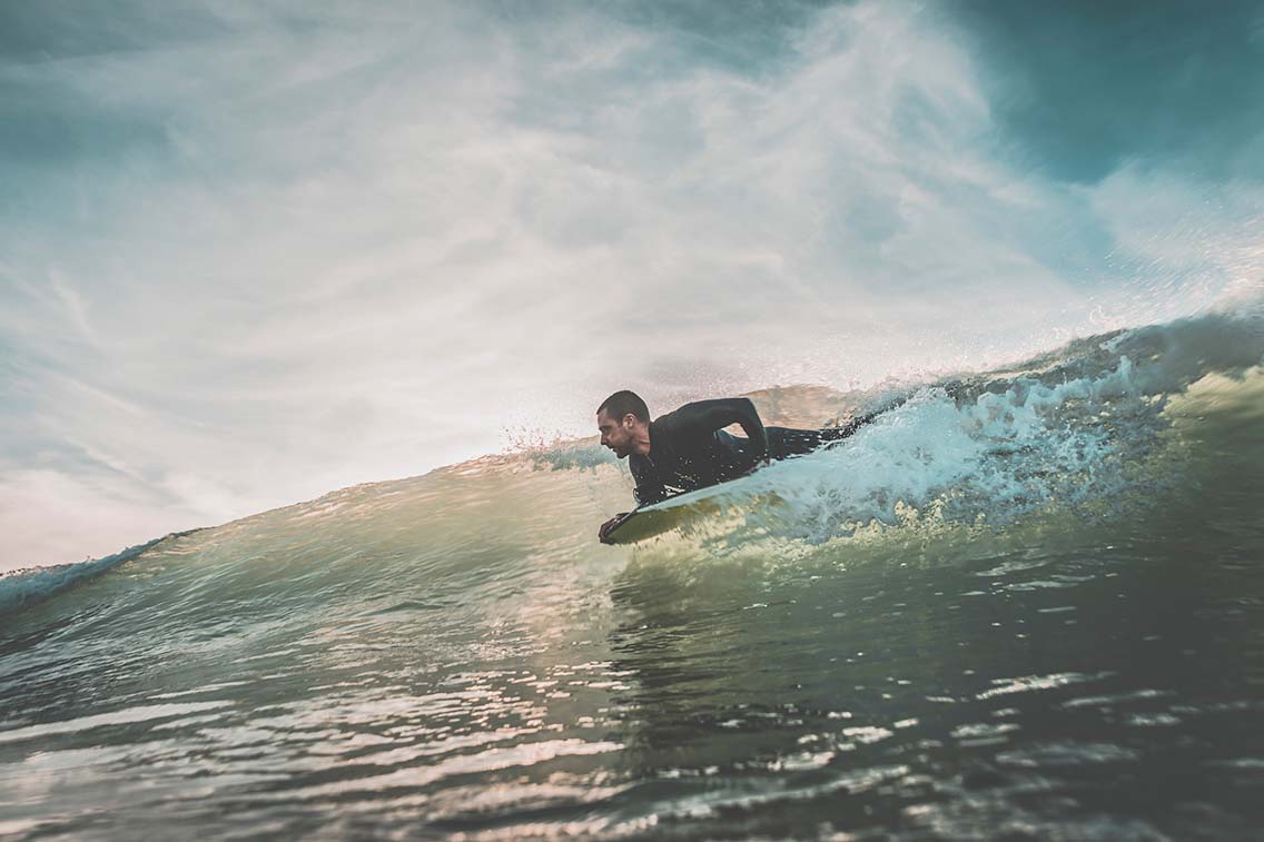 Man catching wave on bodyboard