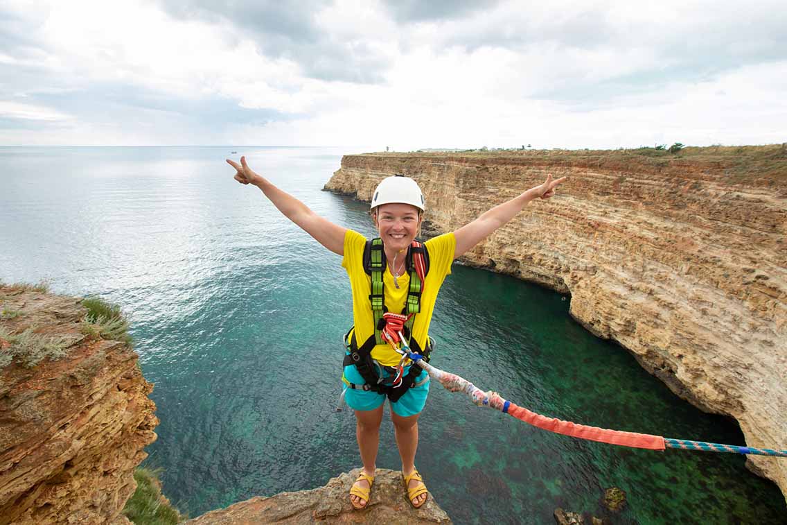 Female bungee jumper posing before jumping