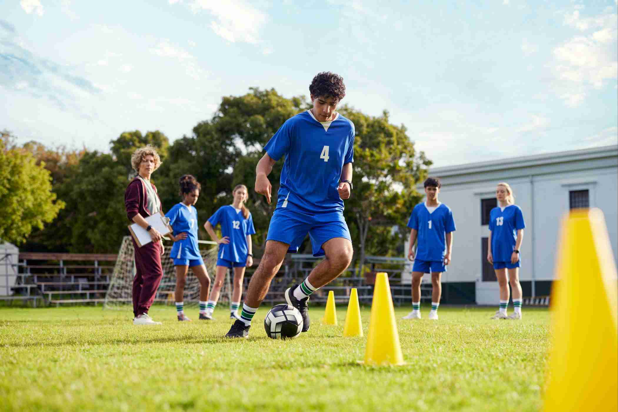 Young football players training