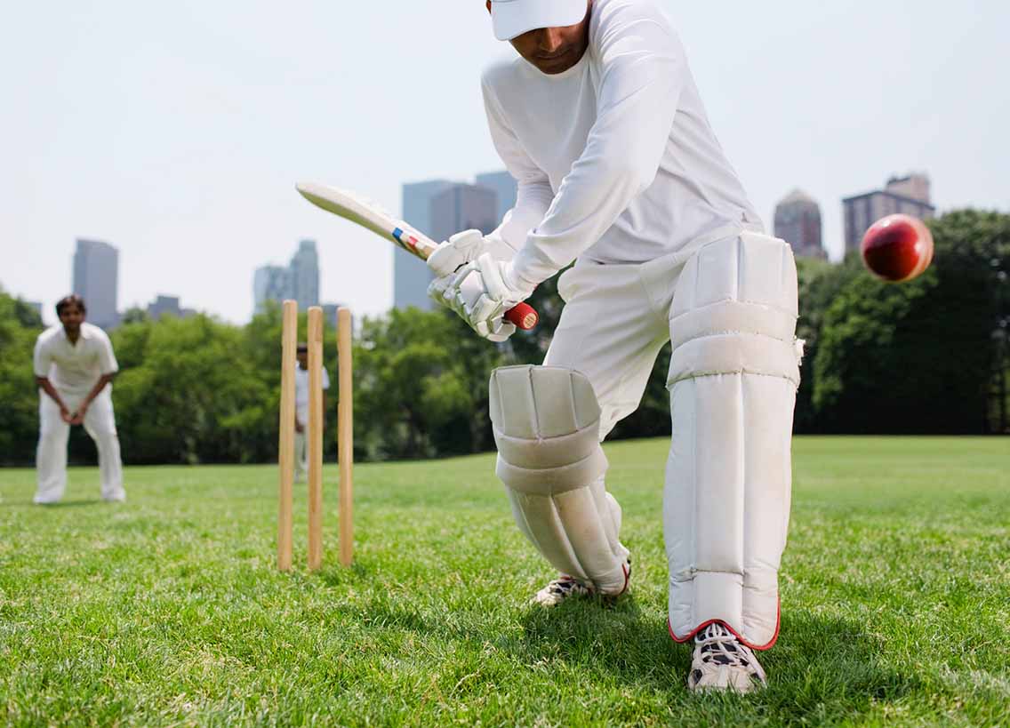 Cricket player preparing to take a ball shot