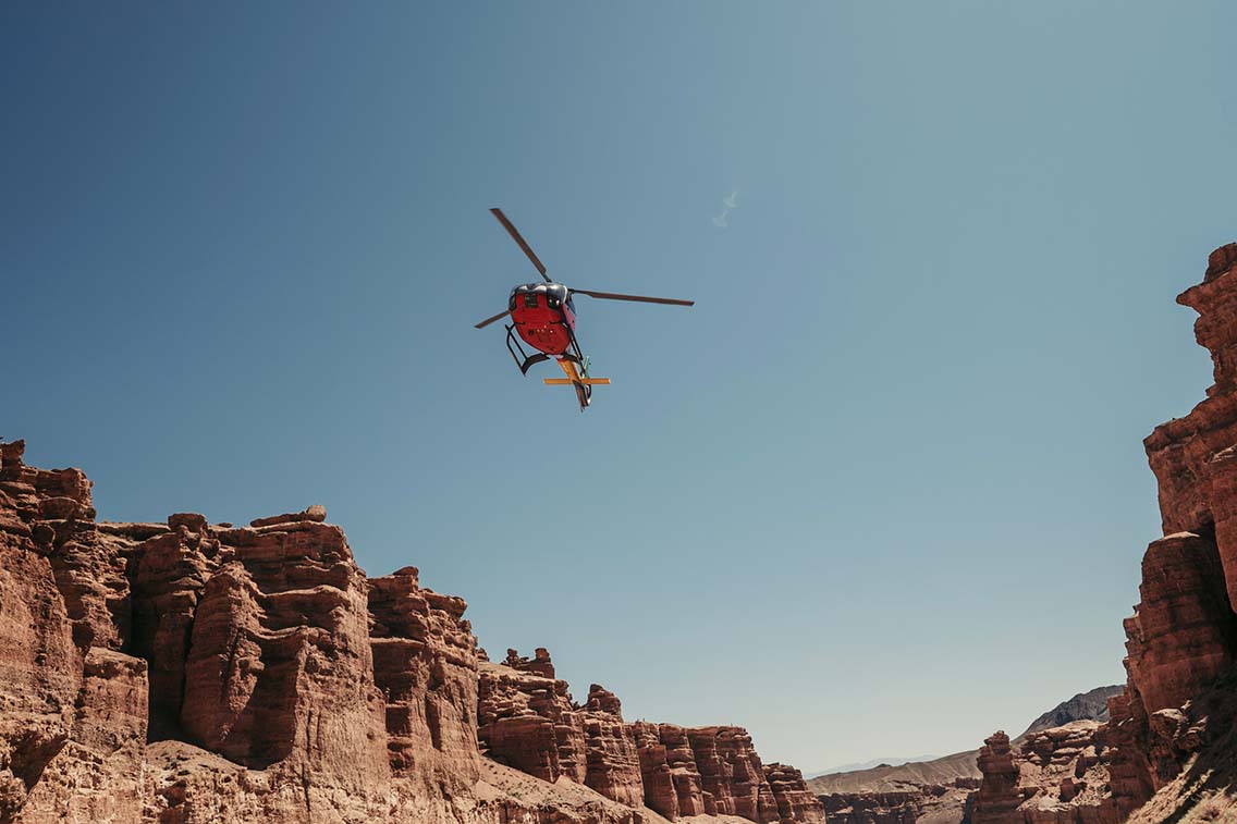 Helicopter above a canyon terrian