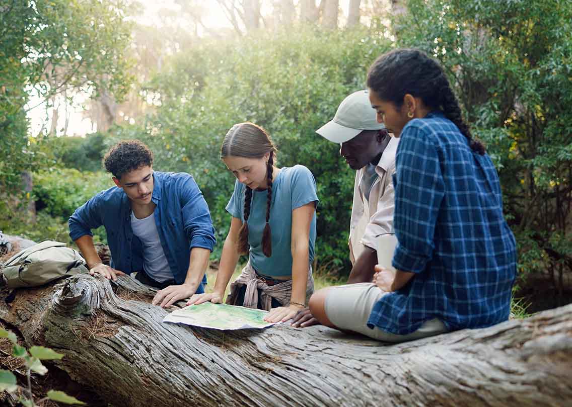 Group of hikers looking at map