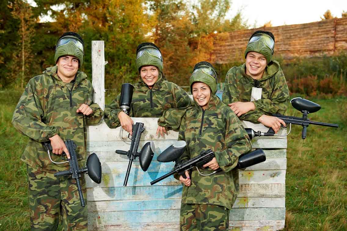 Group in camoflauge with paintball guns