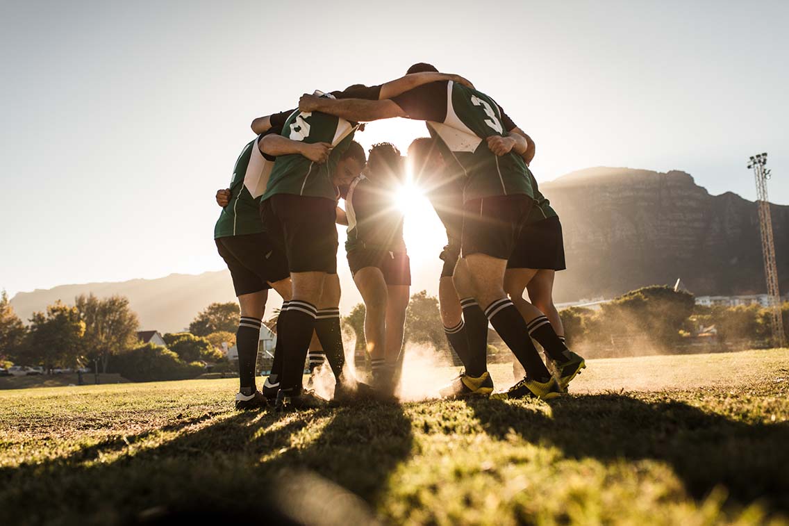 Rugby team in huddle