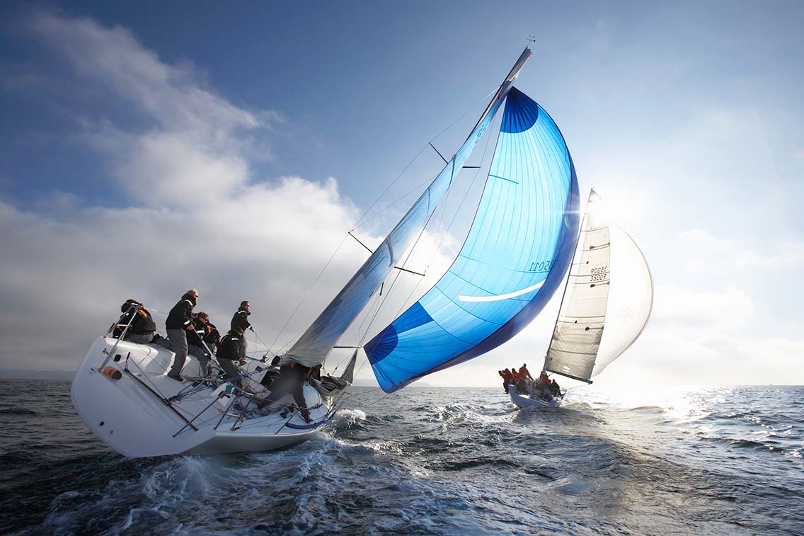 Crew sailing yachts racing