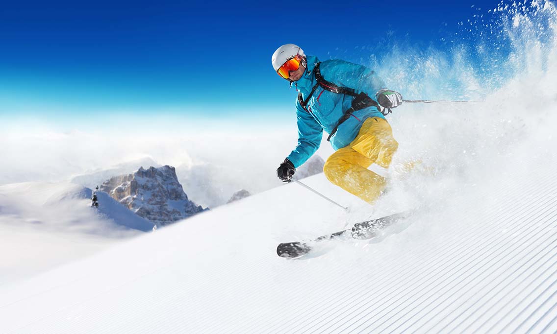 Skier carving on piste