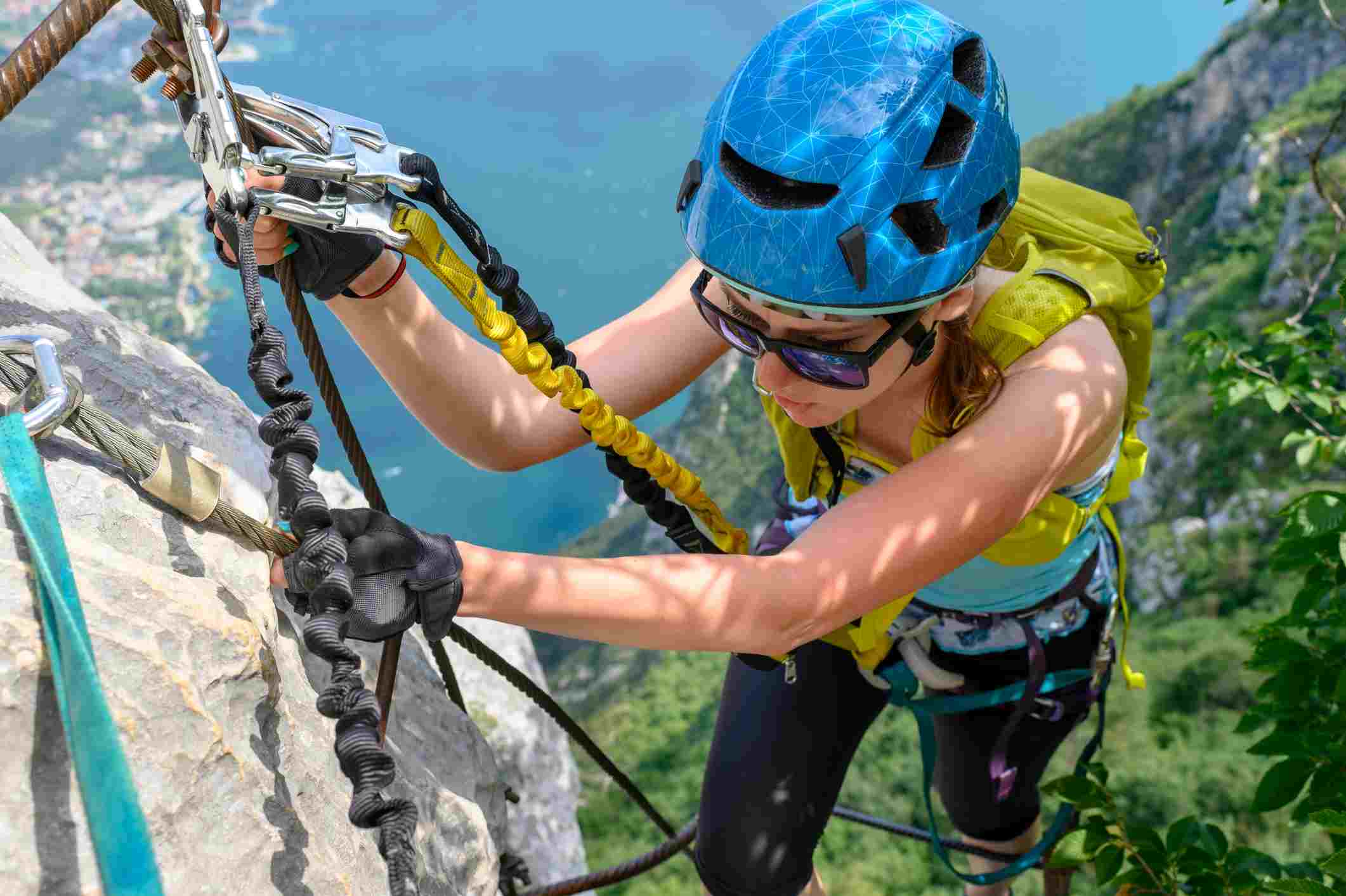 Woman climbing on via ferrata course