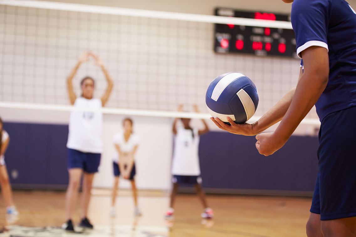 Player preparing to serve volleyball