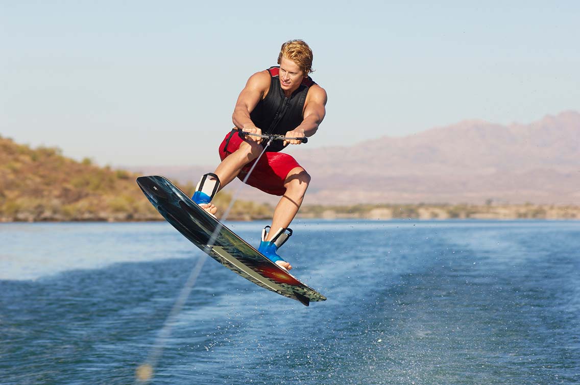 Man jumping on wakeboard