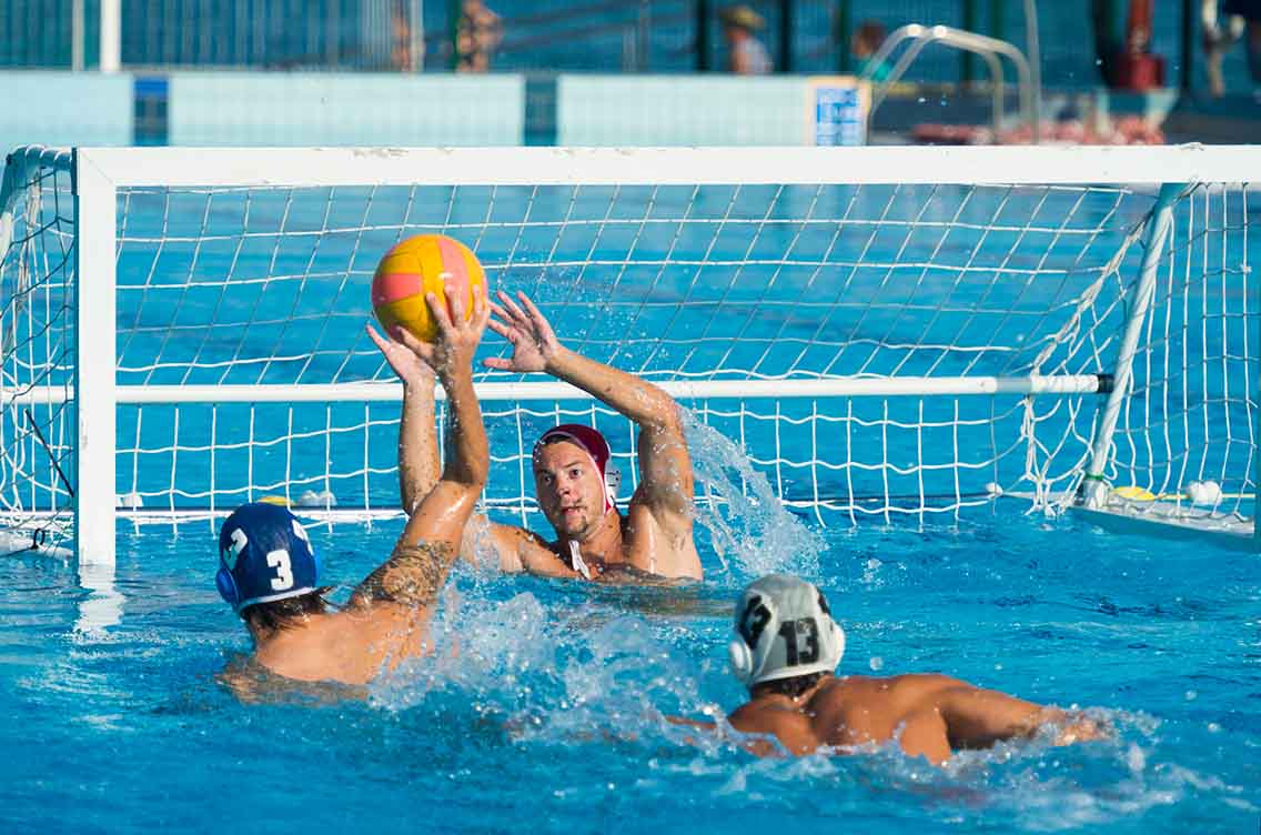 TPlayers trying to score in water polo goal