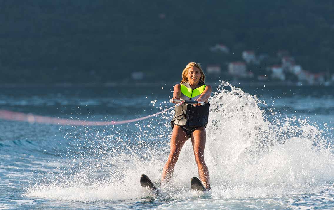 Woman water skiing on lake