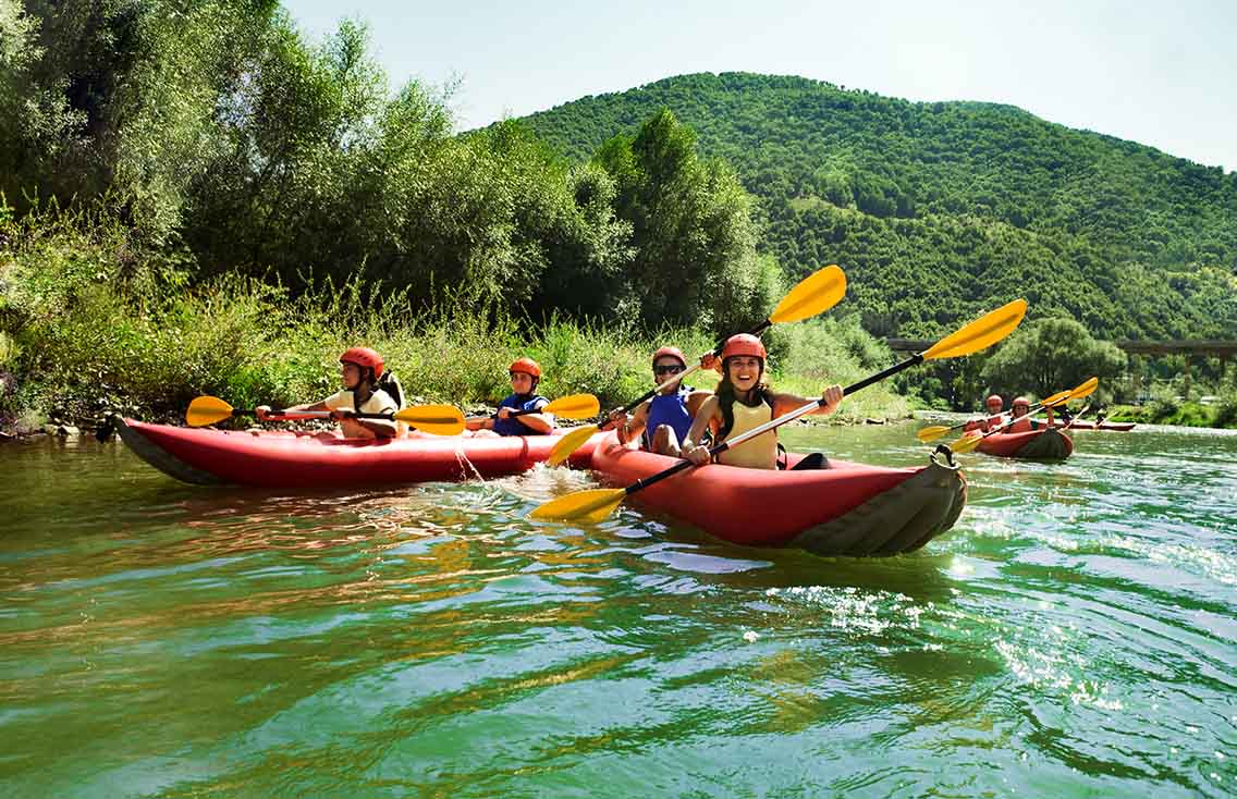 Group in kayaks on a river