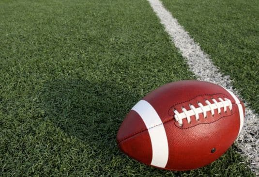 American football ball near the 50 yard