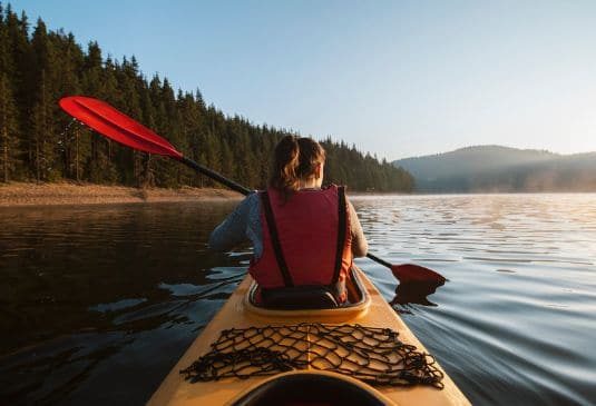 Lady canoeing in Canada