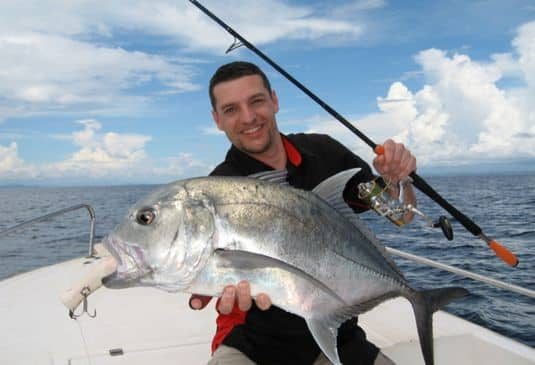 Smiling man caught a huge fish