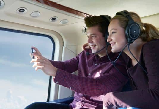 Couple on a helicopter ride