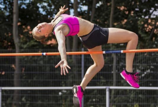 Key benefits Athletics Insurance Female athlete making a jump