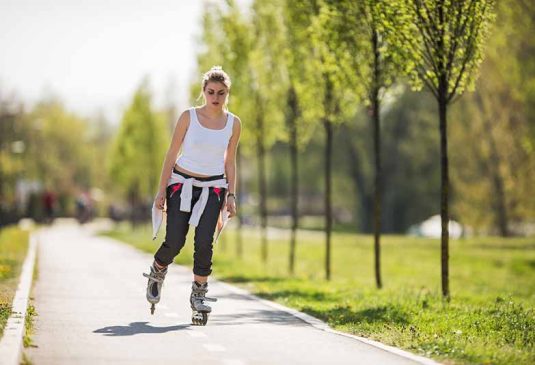 Woman roller blading in the sun