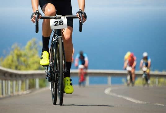 A person cycling in a triathlon