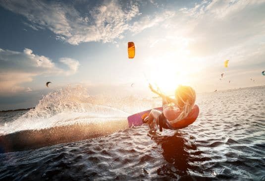 A woman kitesurfing