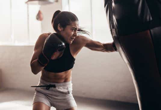 Female boxer training inside a boxing ring stock photo... Save Preview Edit Female boxer training inside a boxing ring Female boxer hitting a huge punching bag at a boxing studio. Woman boxer training hard. Boxing - Sport Stock Photo Description Female boxer hitting a huge punching bag