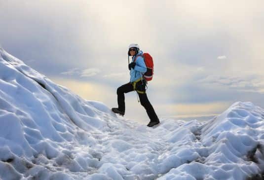 Why Glacier Walking Insurance cr Man walking up a glacier