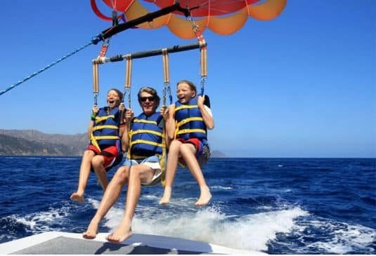 Happy family parasailing