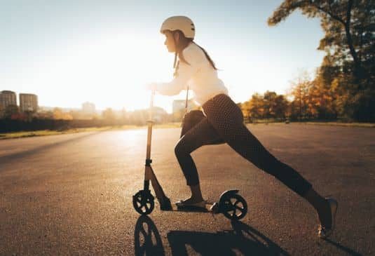 Lady scootering in town