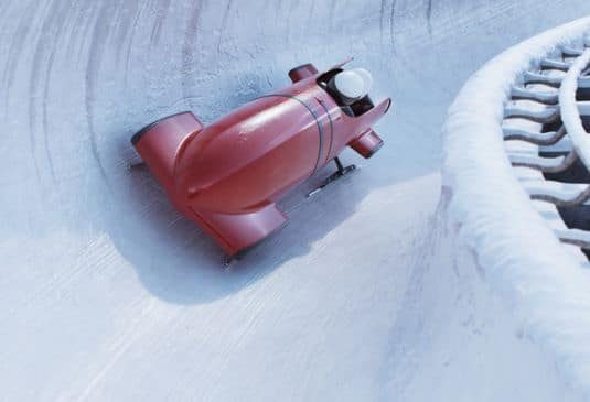 Bobsleigh team riding at a curve