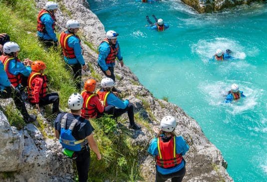 A group of people coasteering in Wales