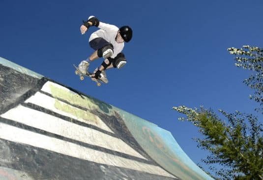 Young skateboarder performing tricks