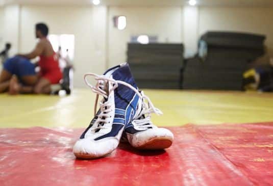 Wrestling Insurance cover cr Wrestling shoes