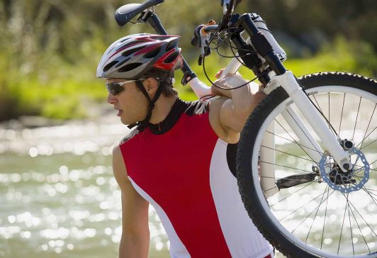 man carrying bike cropped